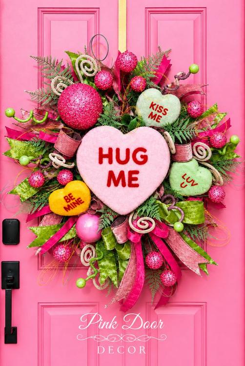 Conversation hearts wreath on the pink door